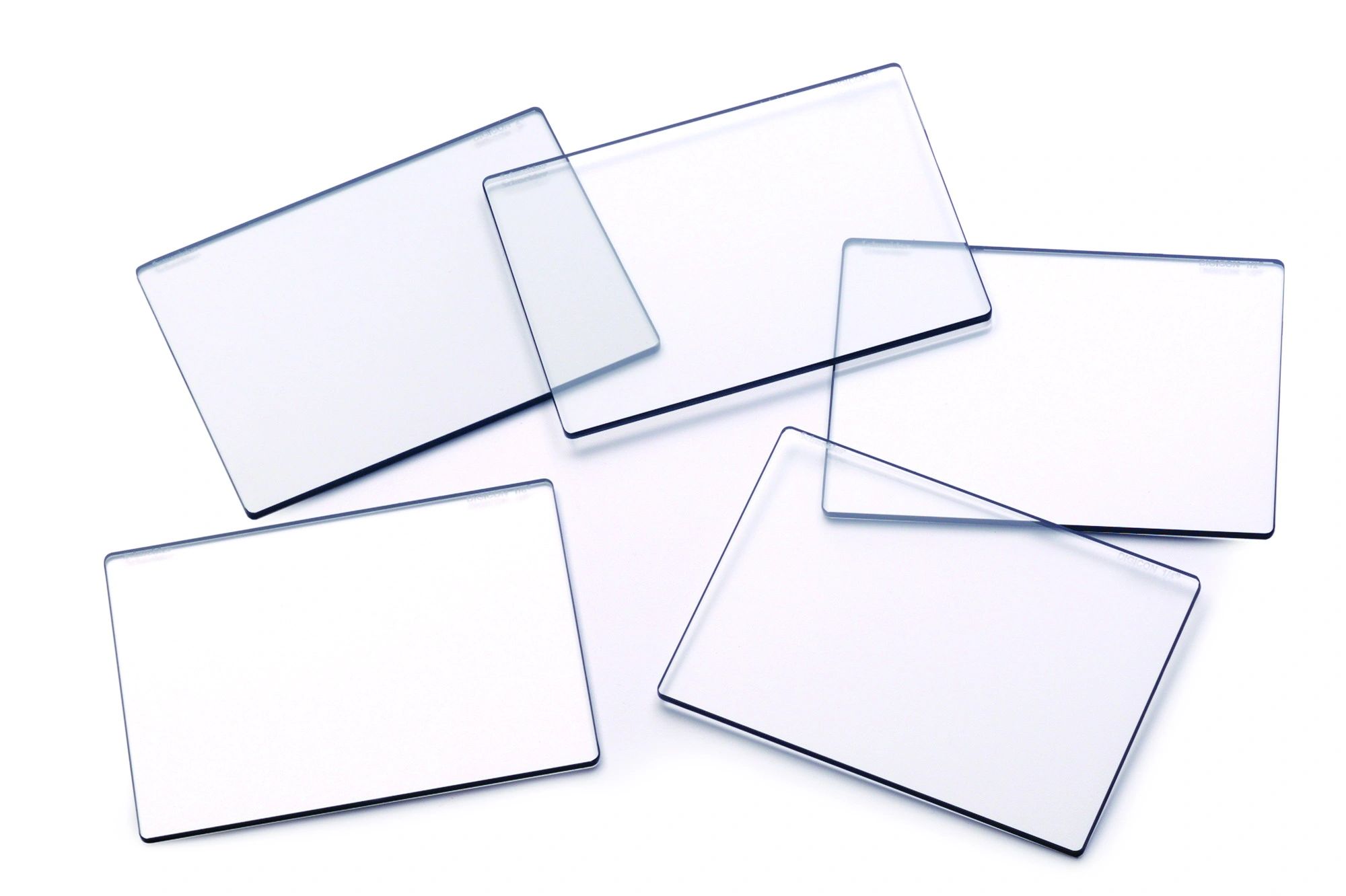 Five blank id badges with blue borders scattered on a white background.